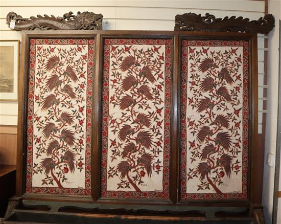 A large 19th century Javanese teak screen with Batik panels by Pamang 59cm